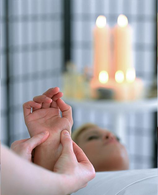 Person receiving reflexology